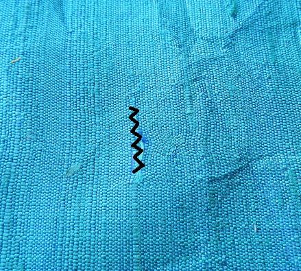 reparar agujeros de tela